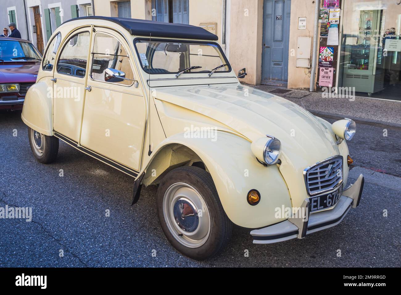 Loriol sur Drome, France - 17 September, 2022: Vintage beige Citroen 2CV with fabric hinged top. Classic car exhibition in Loriol sur Drome, France. Stock Photo