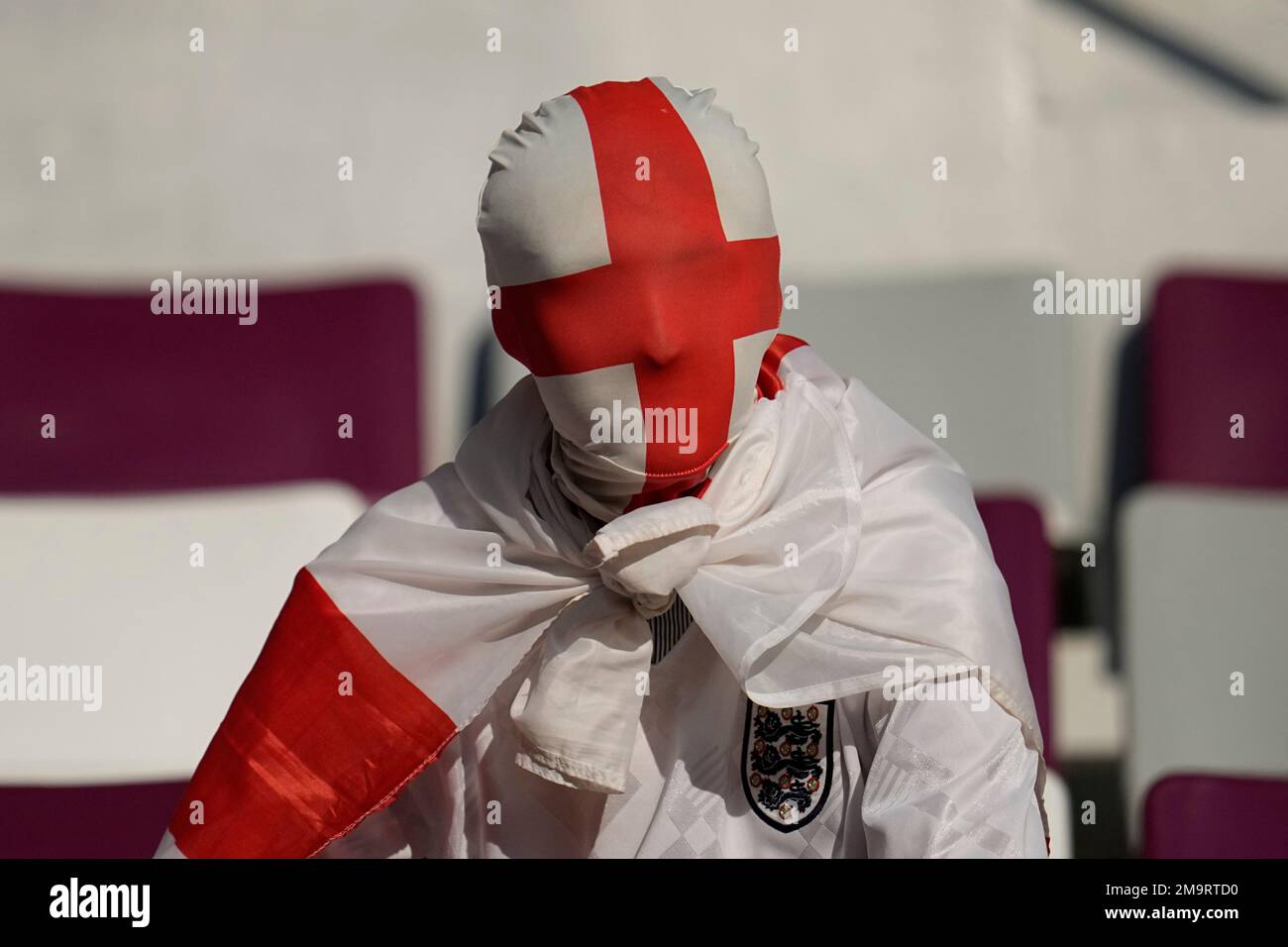 A fan is seen with his head covered in England flag prior to the start ...