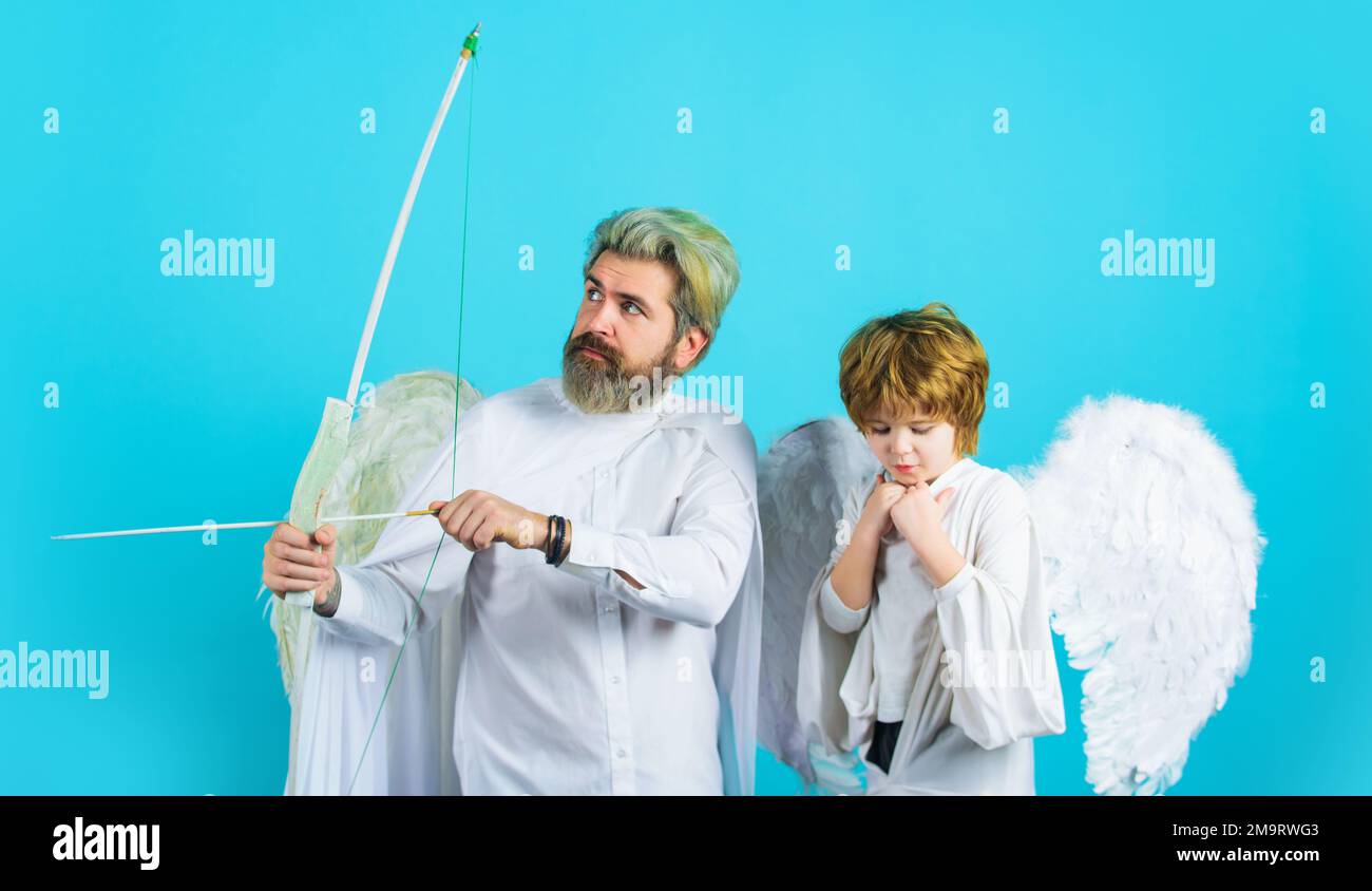 Valentines day angels. Little cupid child boy and father with bow and arrow. Arrows of love. Stock Photo