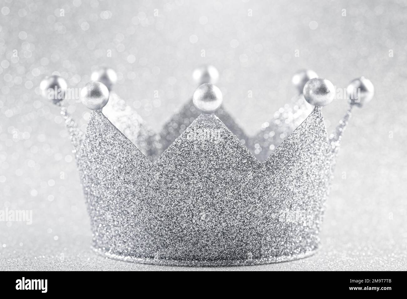 Classic Silver Crown on a Glittery Silver Background Stock Photo - Alamy