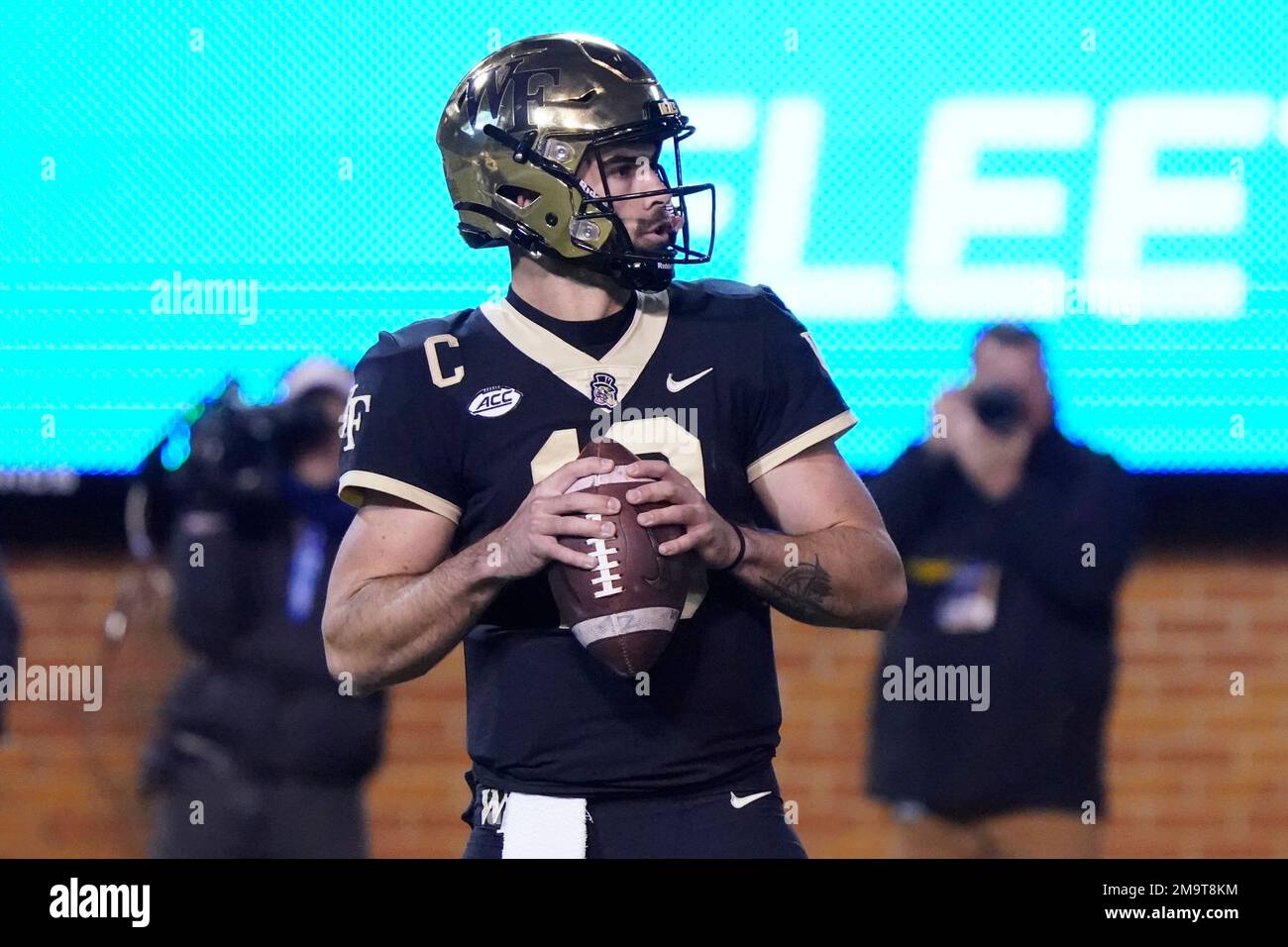 Wake Forest quarterback Sam Hartman (10) looks to pass against Syracuse