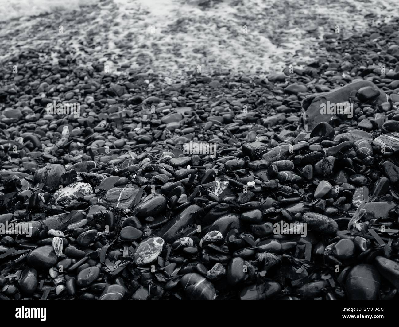 Dark black coastal rocks hi-res stock photography and images - Alamy