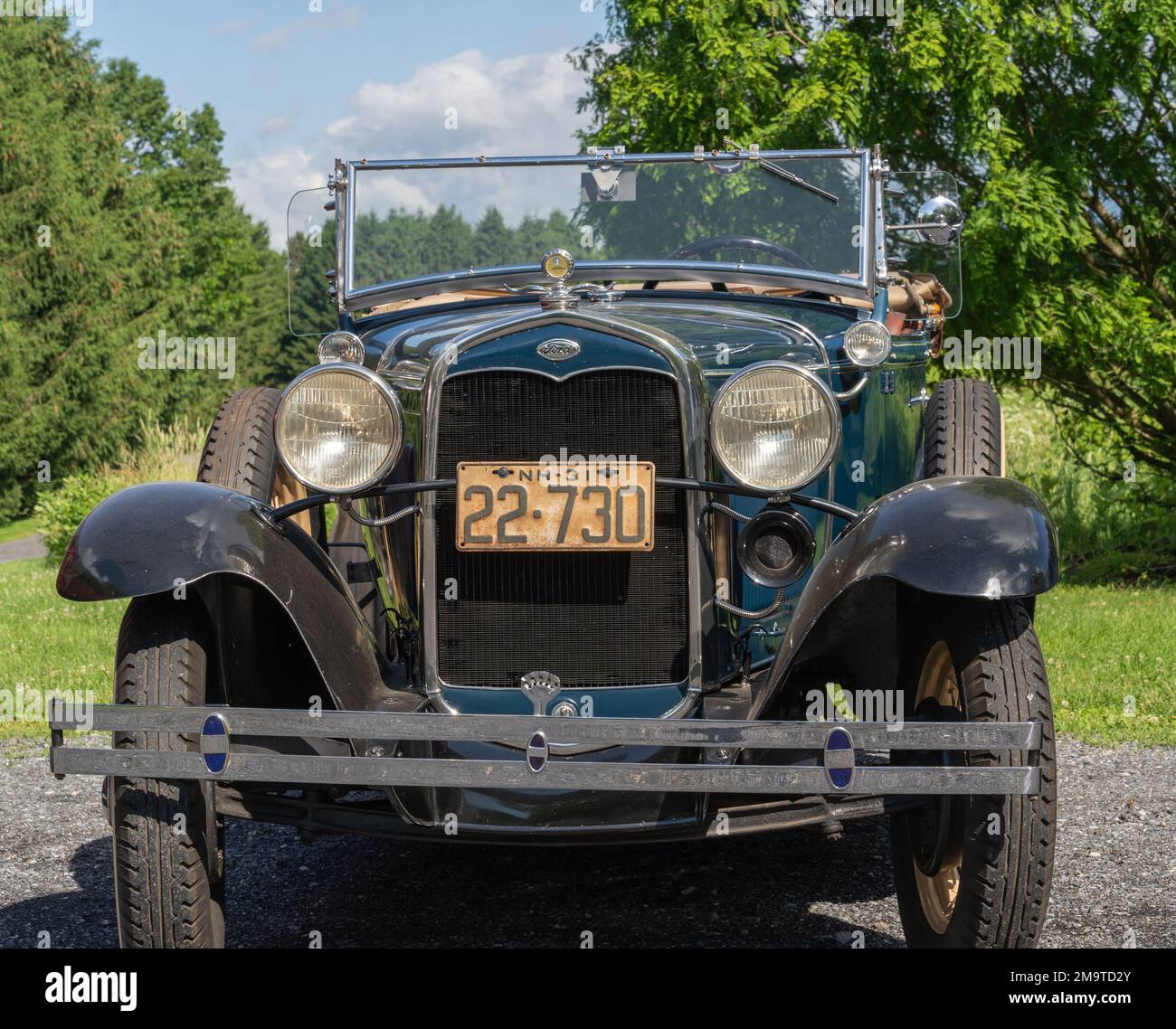 Berks County, Pennsylvania, June 9, 2022: Vintage Green Ford Model A Antique Car parked with trees in background Stock Photo