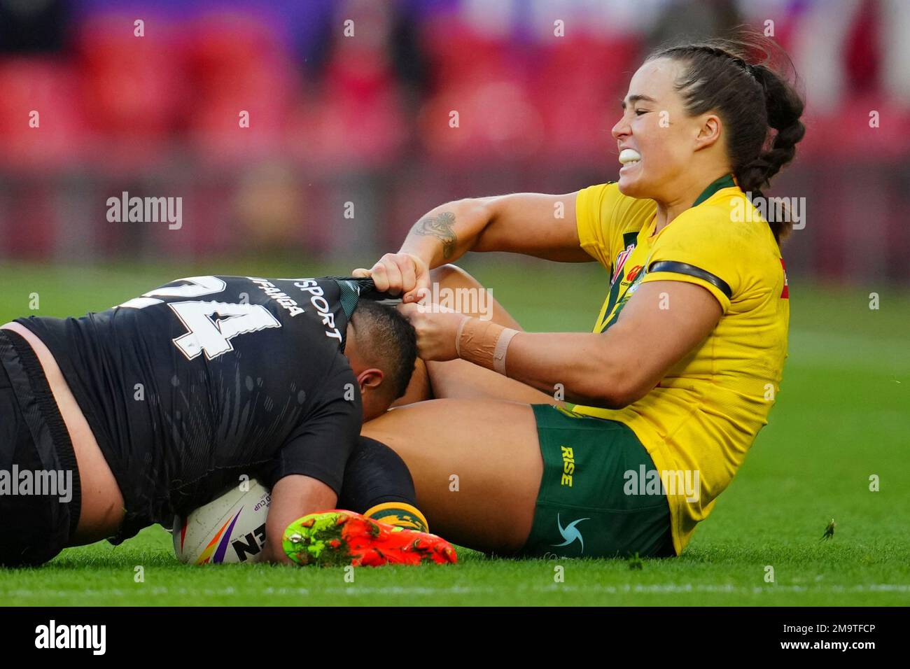 Australia's Isabelle Kelly, right, tackles New Zealand's Mele Hufanga