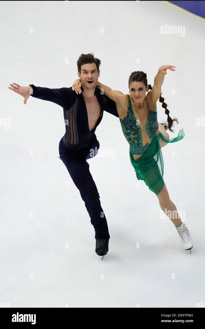 Laurence Fournier Beaudry, right, and Nikolaj Soerensen of Canada perform in the ice dance rhythm dance program in the Grand Prix of Figure Skating