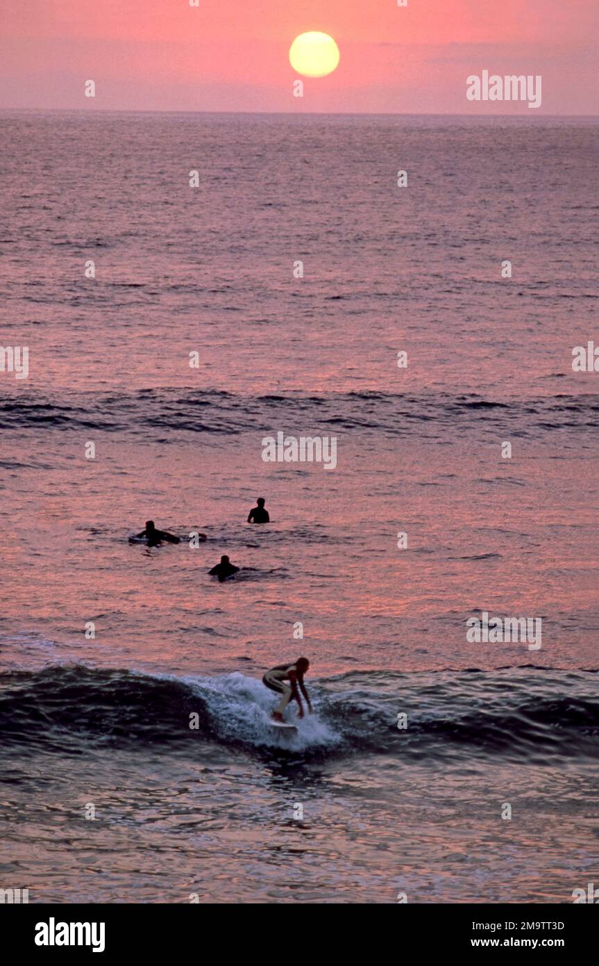 Surfers at beach on Southern California coast. Stock Photo