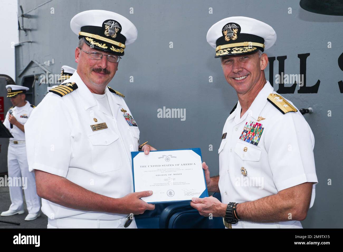 PHILIPPINE SEA (May 20, 2022) Rear Adm. J.T. Anderson, right, from ...