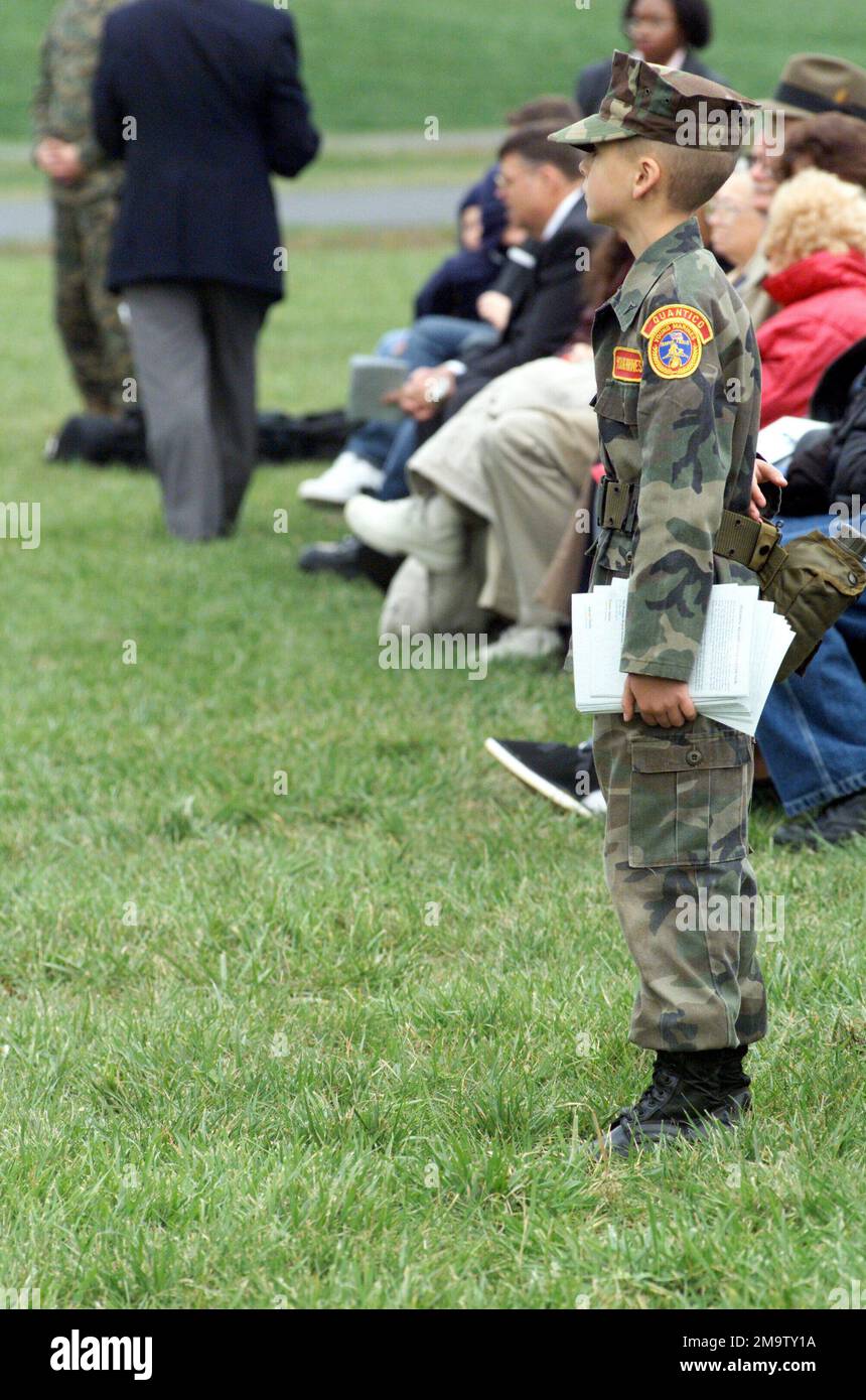 031111-M-4697Y-005. A Young Marine stands by to usher Veterans to their seats for the Veteran's Day Ceremony at Quantico, Virginia (VA). The ceremony is held each year to honor those who have both served and died for their country. The Young Marines, is an official youth program of the Marine Corps League. Stock Photo