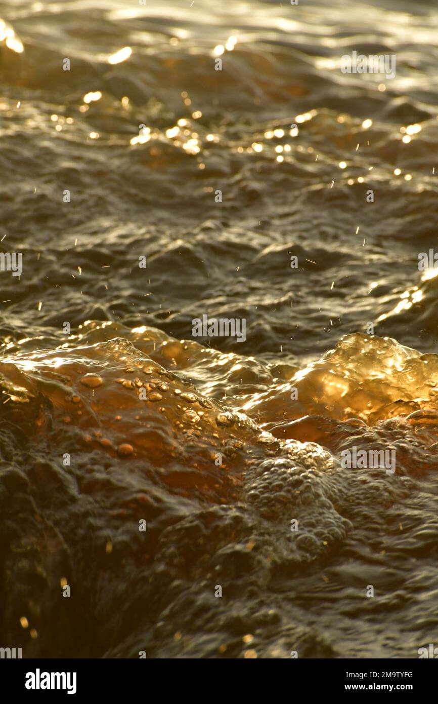 Flood water from rain draining into the creek Stock Photo