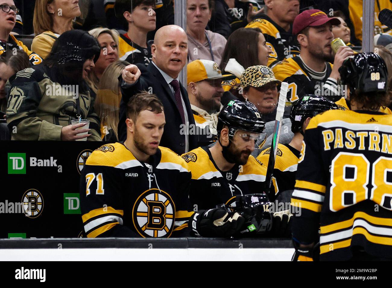 Boston Bruins head coach Jim Montgomery directs his players during the third period of an NHL hockey game against the Vancouver Canucks Sunday, Nov