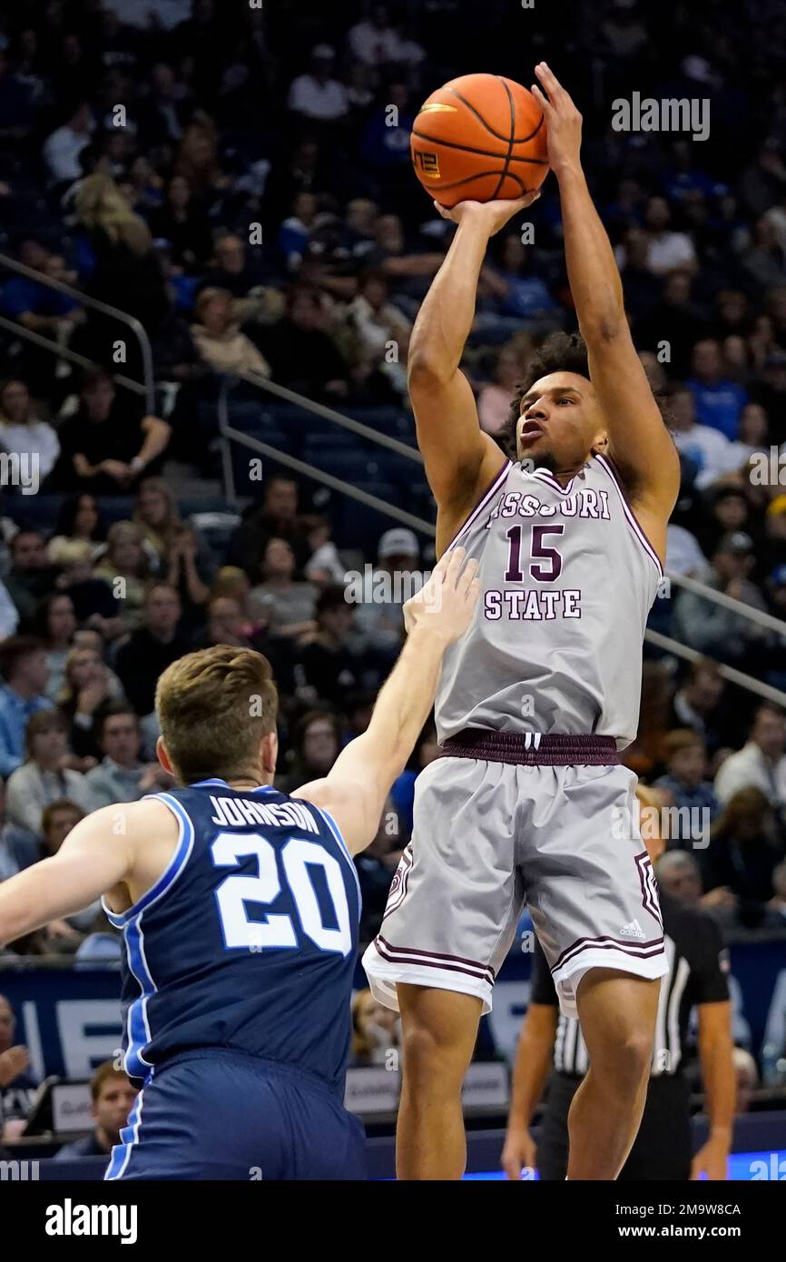 Missouri State guard Matthew Lee (15) shoots as BYU guard Spencer Johnson  (20) defends during the