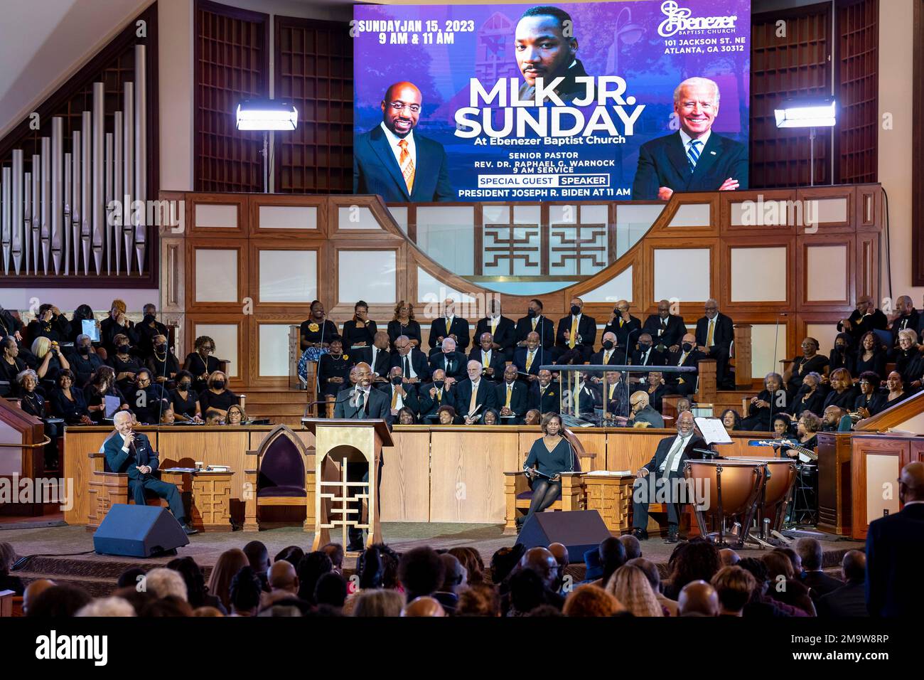 Atlanta, United States of America. 15 January, 2023. U.S President Joe Biden, listens to remarks by the Reverend, Sen. Raphael Warnock during a celebration of Martin Luther King Jr. Day at Ebenezer Baptist Church, January 15, 2023 in Atlanta, Georgia. Biden is the first sitting president to delivered a sermon at the church where Martin Luther King Jr. was a pastor. Credit: Adam Schultz/White House Photo/Alamy Live News Stock Photo