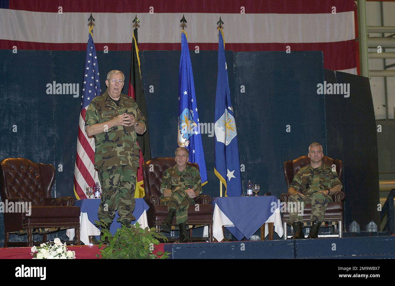 US Secretary of the Air Force (SECAF) Dr. James G. Roche (left), accompanied by US Air Force (USAF) General (GEN) Robert H. (Doc) Foglesong, US Air Forces in Europe (USAFE) Commander, and Brigadier General (BGEN) Erwin F. Lessel. III (right), Commander, 86th Airlift Wing (AW), speaks to Airmen during his visit to Ramstein Air Base (AB), Germany. US Secretary of the Air Force (SECAF) Dr. James G. Roche (left), accompanied by US Air Force (USAF) General (GEN) Robert H. (Doc) Foglesong, US Air Forces in Europe (USAFE) Commander, and Brigadier General (BGEN) Erwin F. Lessel. III (right), Commander Stock Photo