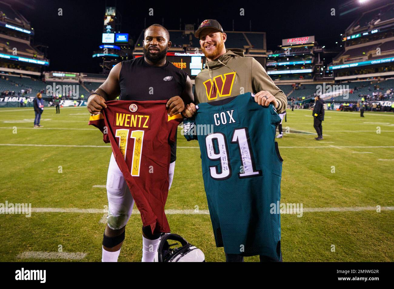 Philadelphia Eagles defensive end Fletcher Cox (91) swaps jerseys with