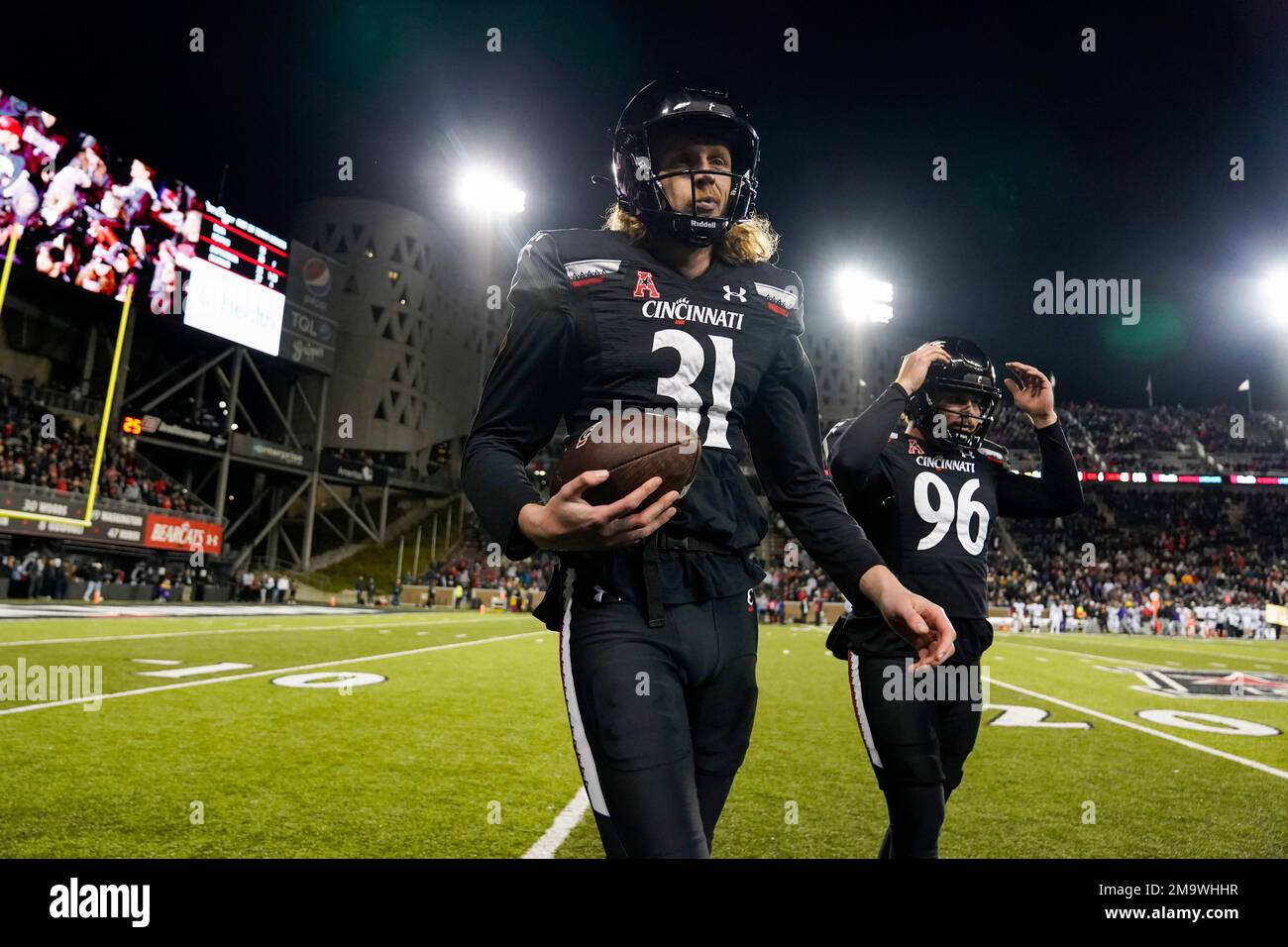 Cincinnati punter Mason Fletcher (31) prepares to punt during an NCAA