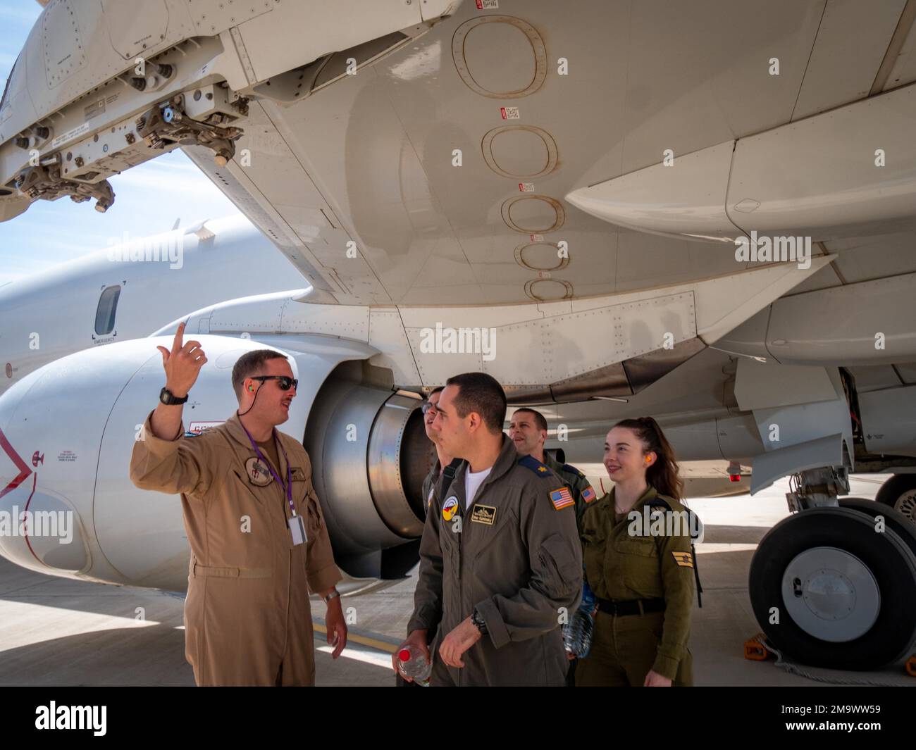 220520-N-VH871-1254 OVDA AIR FORCE BASE, Israel (May 20, 2022) Lt. Josh Schuh, assigned to the 'Grey Knights' of Patrol Squadron (VP) 46, deployed with Commander, Task Force (CTF) 57, conducts a tour of a P-8A maritime patrol aircraft to members of the Israeli Navy, May 20. CTF 57 aircraft conduct missions in support of maritime operations to ensure security and stability in the Middle East region. Stock Photo