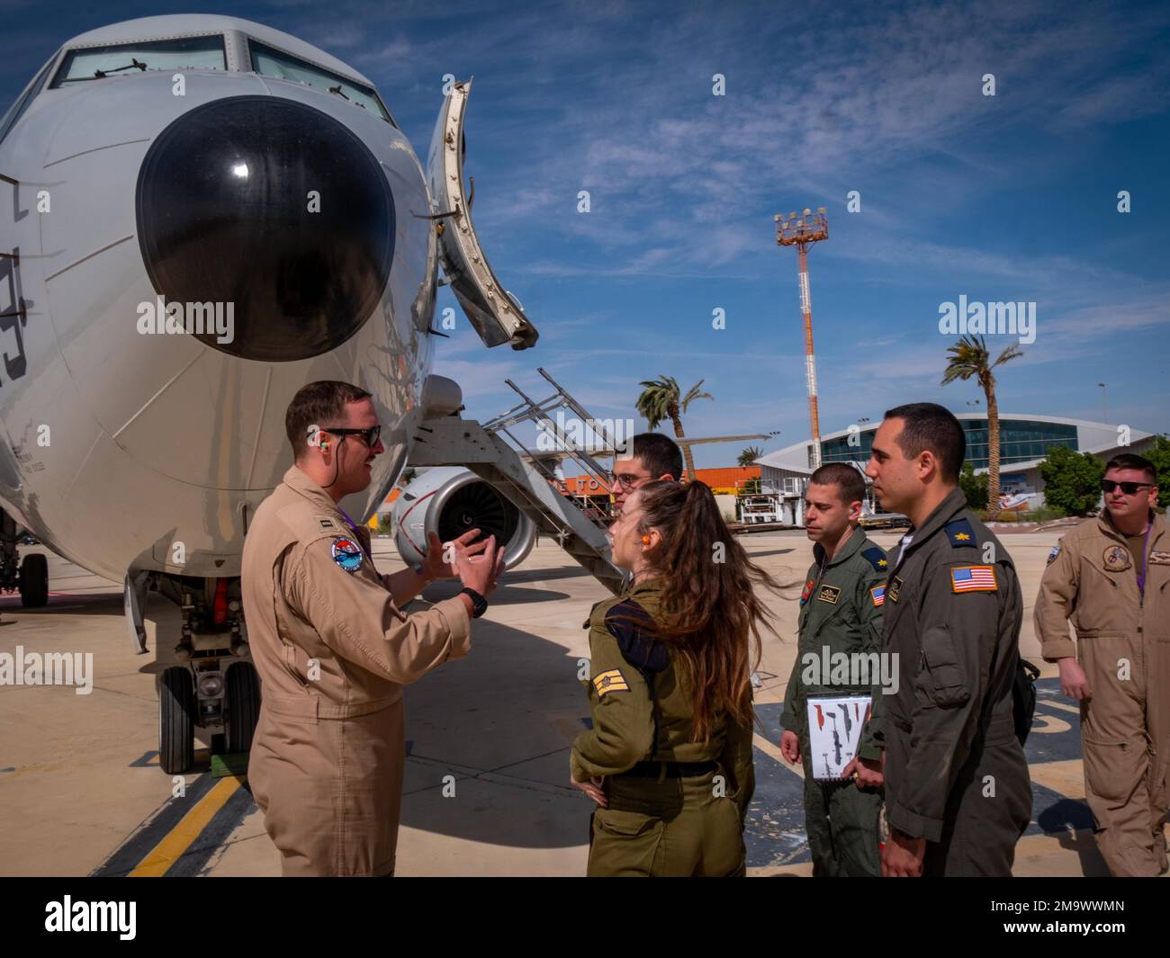 220520-N-VH871-1272 OVDA AIR FORCE BASE, Israel (May 20, 2022) Lt. Josh Schuh, assigned to the 'Grey Knights' of Patrol Squadron (VP) 46, deployed with Commander, Task Force (CTF) 57, conducts a tour of a P-8A maritime patrol aircraft to members of the Israeli Navy, May 20. CTF 57 aircraft conduct missions in support of maritime operations to ensure security and stability in the Middle East region. Stock Photo