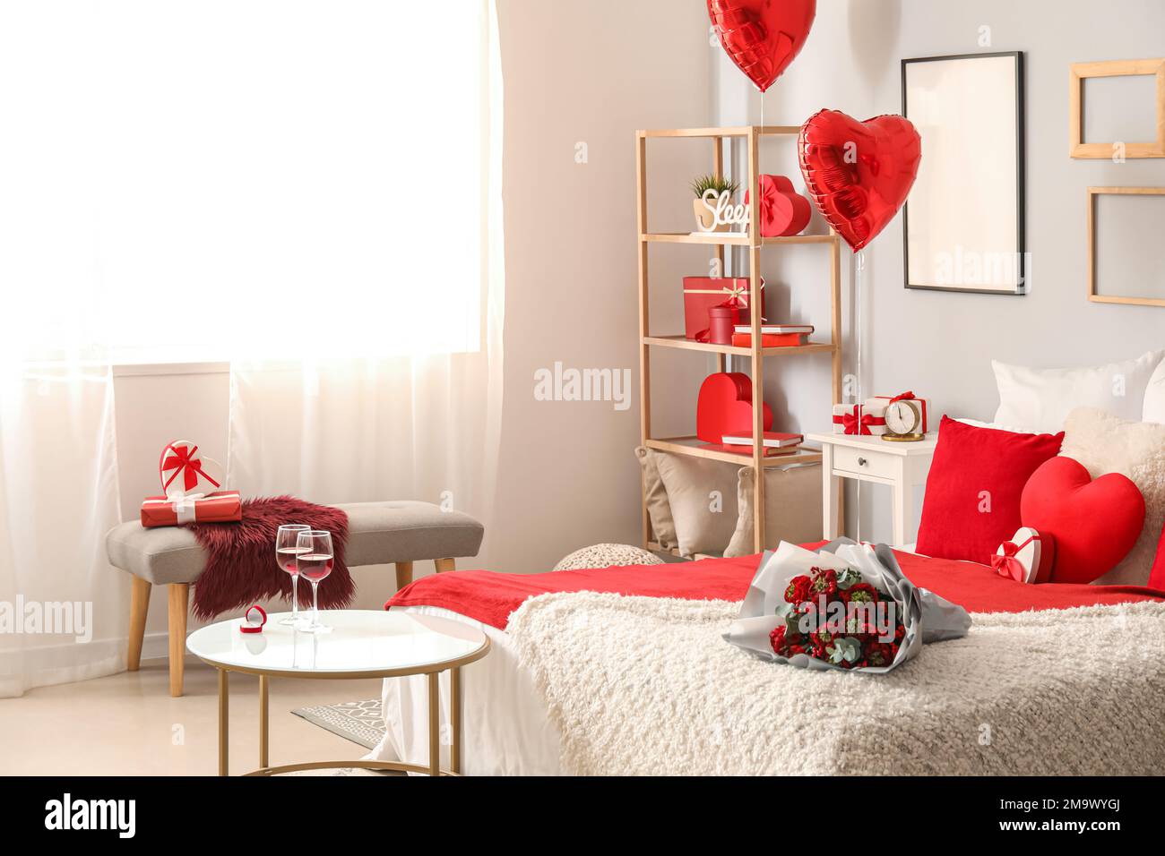 Interior of bedroom decorated for Valentine\'s Day with flowers and ...