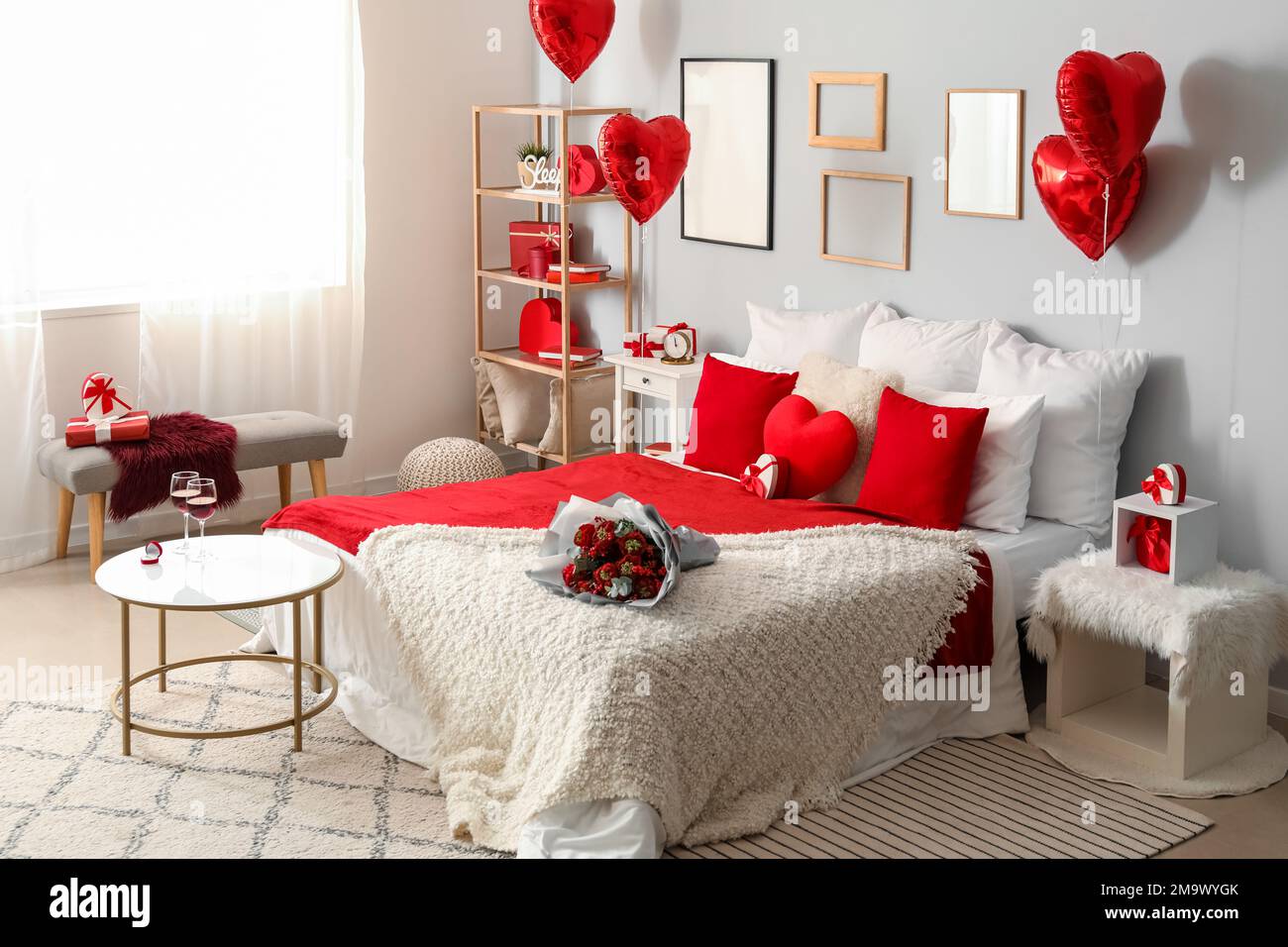 Interior of bedroom decorated for Valentine\'s Day with flowers and ...