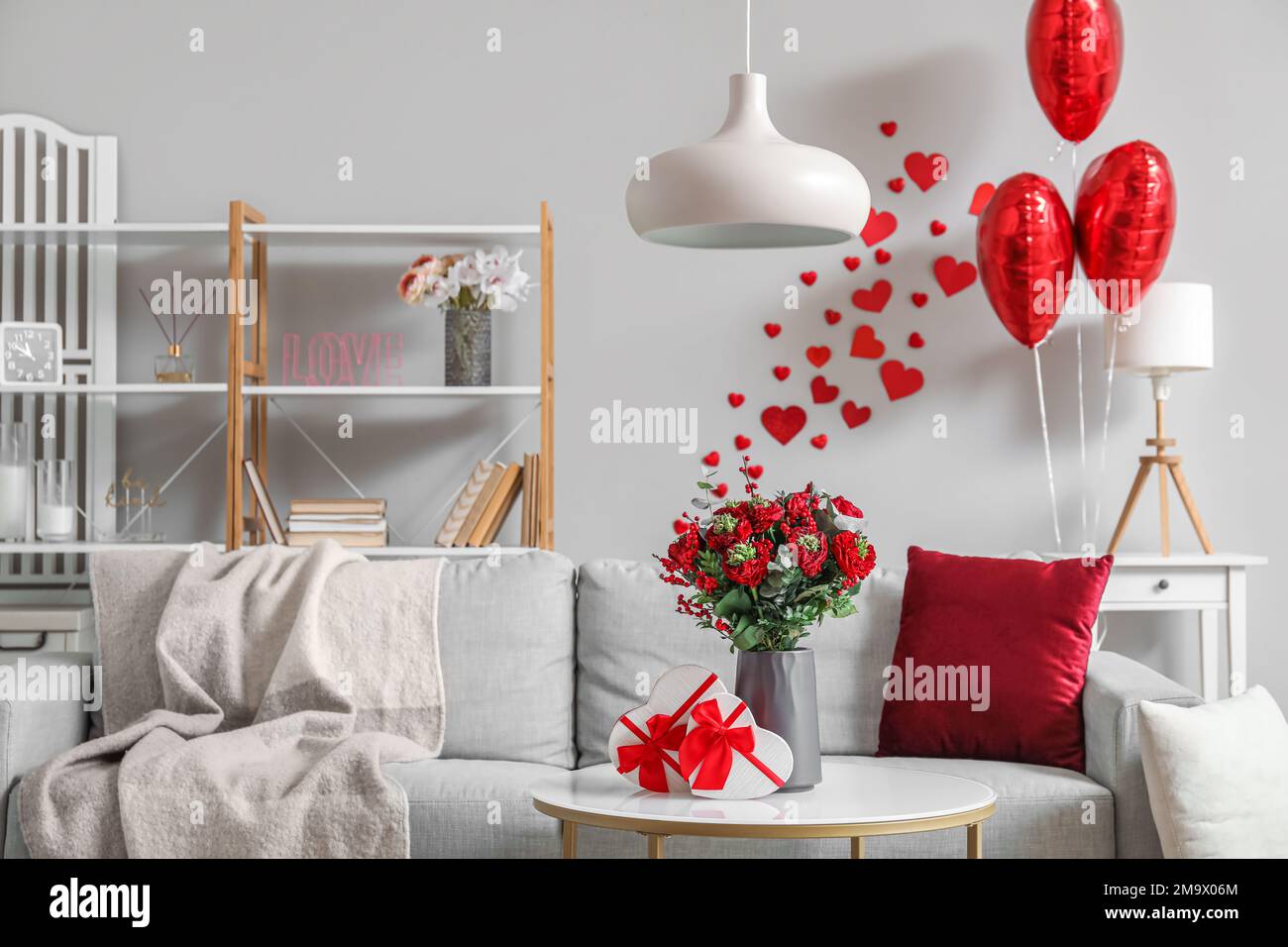 Interior of living room decorated for Valentine's Day with sofa ...