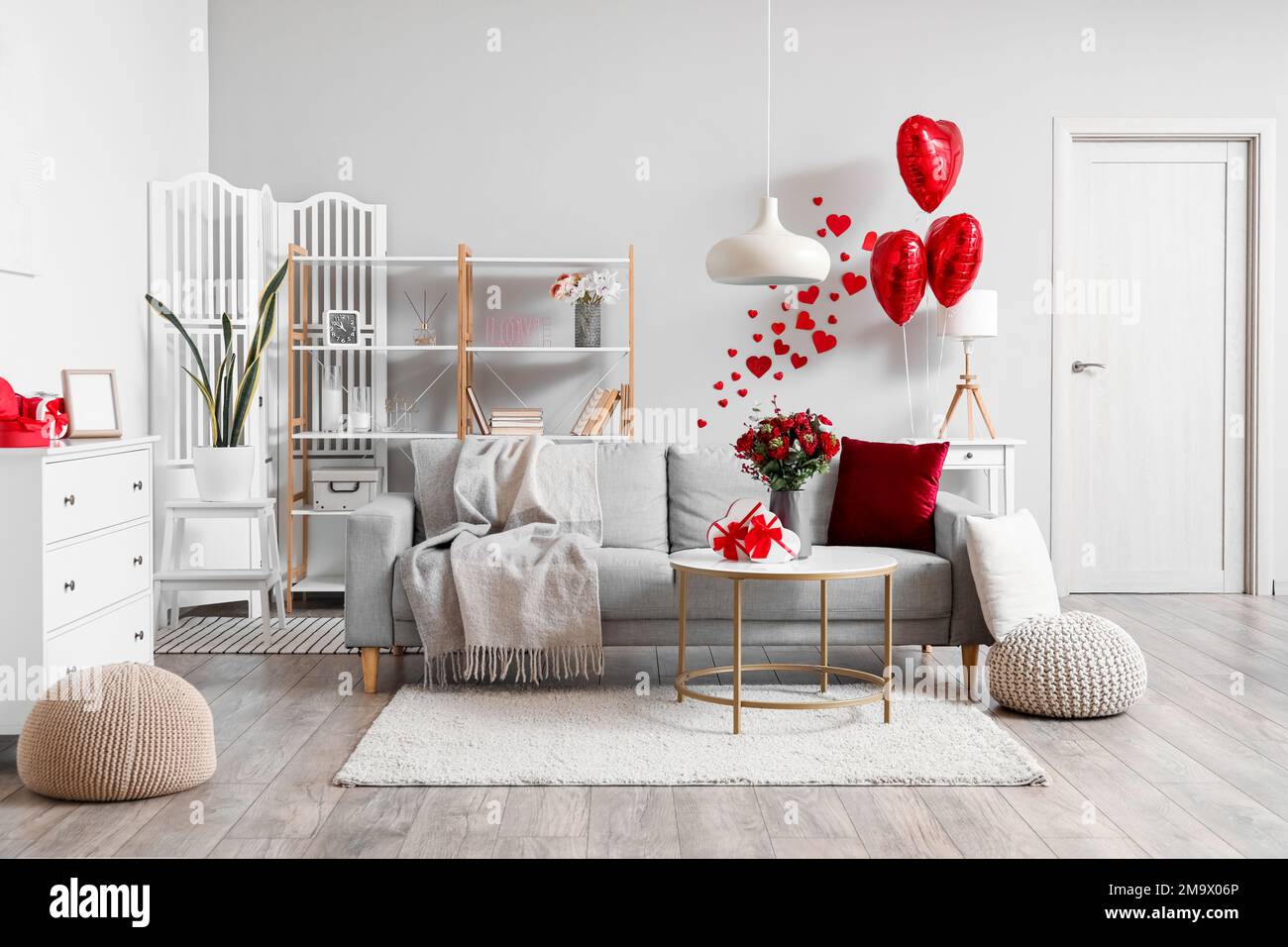 Interior of living room decorated for Valentine's Day with sofa ...