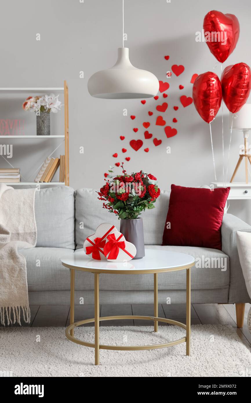 Interior of living room decorated for Valentine's Day with sofa ...