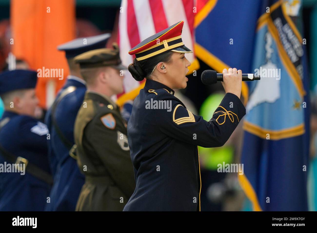 U.S Army Staff Sergent Bethsaida Patterson signs the national anthem before  the start of during an NFL football game between the Miami Dolphins and the  Cleveland Browns, Sunday, Nov. 13, 2022, in