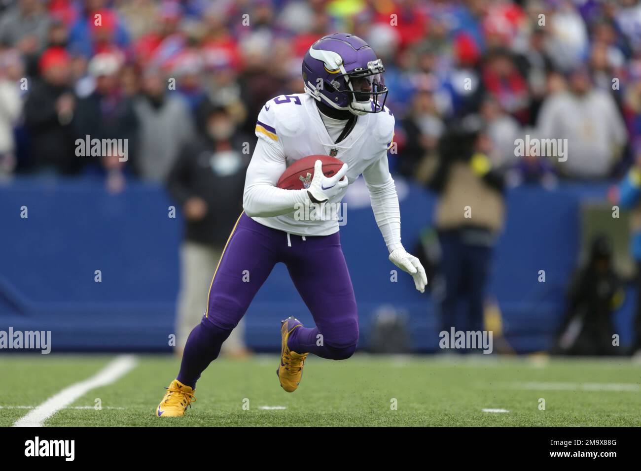 Minnesota Vikings wide receiver Jalen Reagor (5) runs with the ball in the  first half of an NFL football game against the Buffalo Bills, Sunday, Nov.  13, 2022, in Orchard Park, N.Y. (