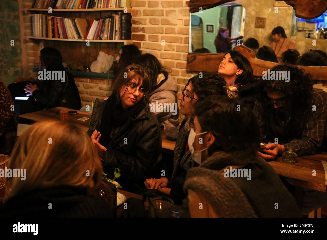 Tehran, Tehran, Iran. 18th Jan, 2023. Iranian young people listen to a