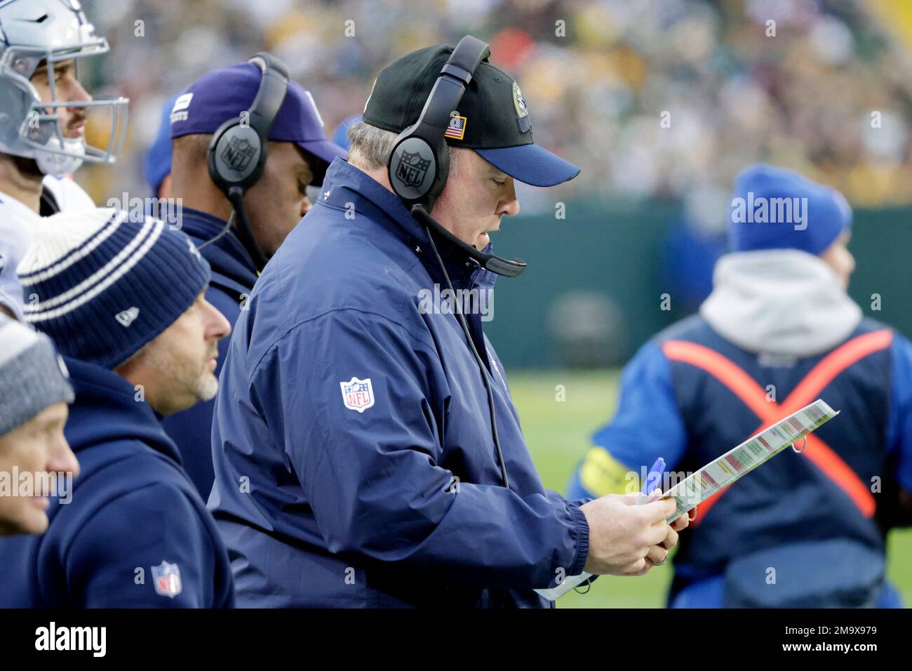 Dallas Cowboys head coach Mike McCarthy looks at his playcard during the  first half of an NFL football game against the Green Bay Packers, Sunday,  Nov. 13, 2022, in Green Bay, Wis. (