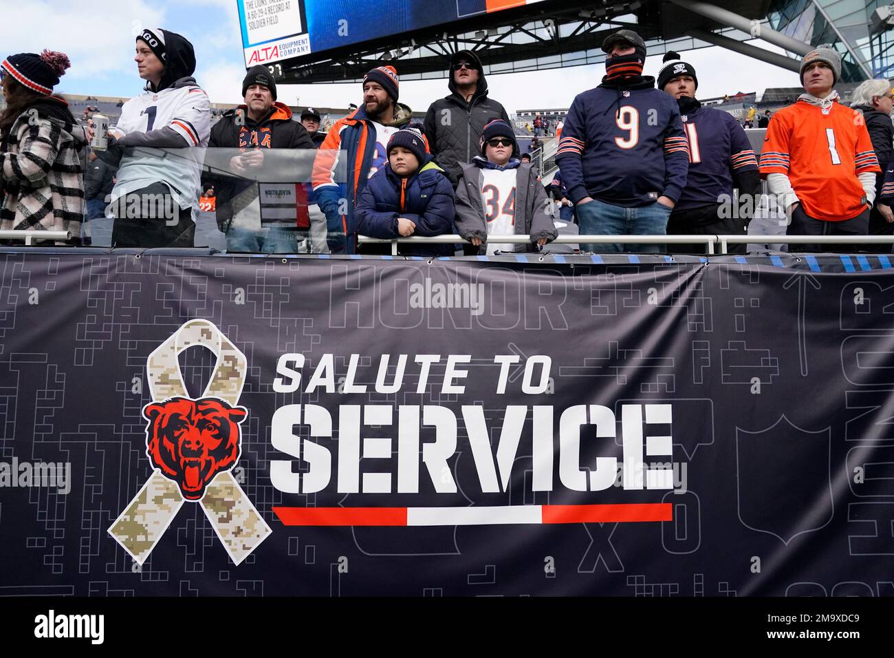 Chicago Bears fans watch during warmups under a Salute To Service sign  before an NFL football game against the Detroit Lions in Chicago, Sunday,  Nov. 13, 2022. (AP Photo/Charles Rex Arbogast Stock