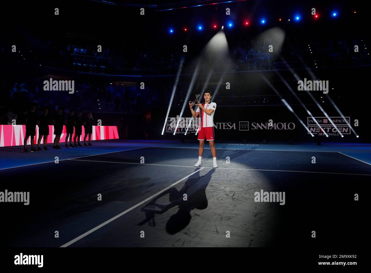 Winner United States' Brandon Nakashima holds a trophy during a medal