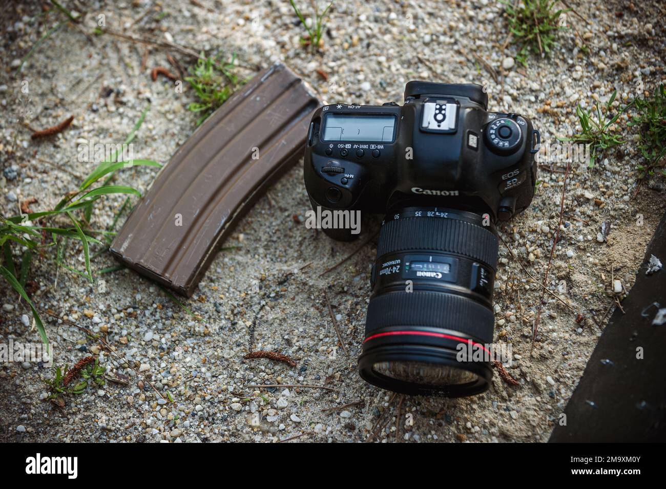 A magazine and camera are placed on the ground during the 2022 Spc ...