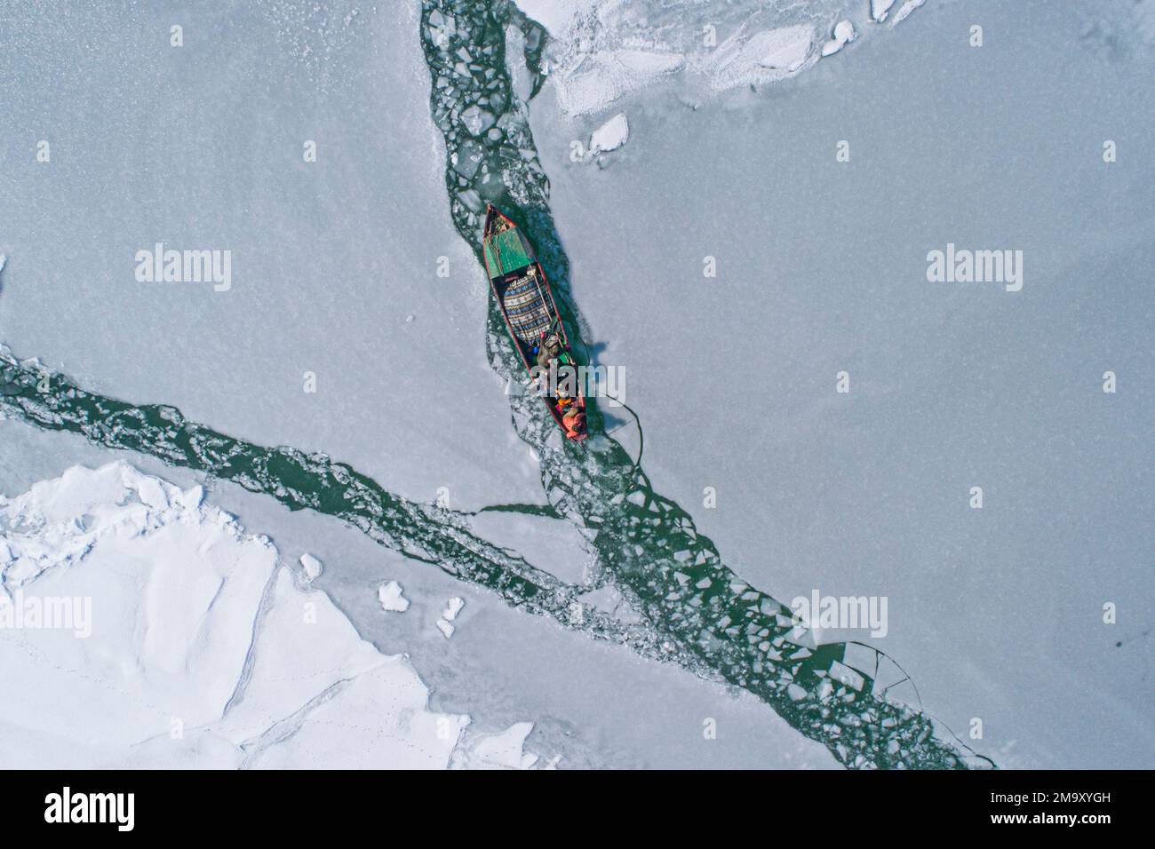 Fishing on frozen lake Stock Photo Alamy