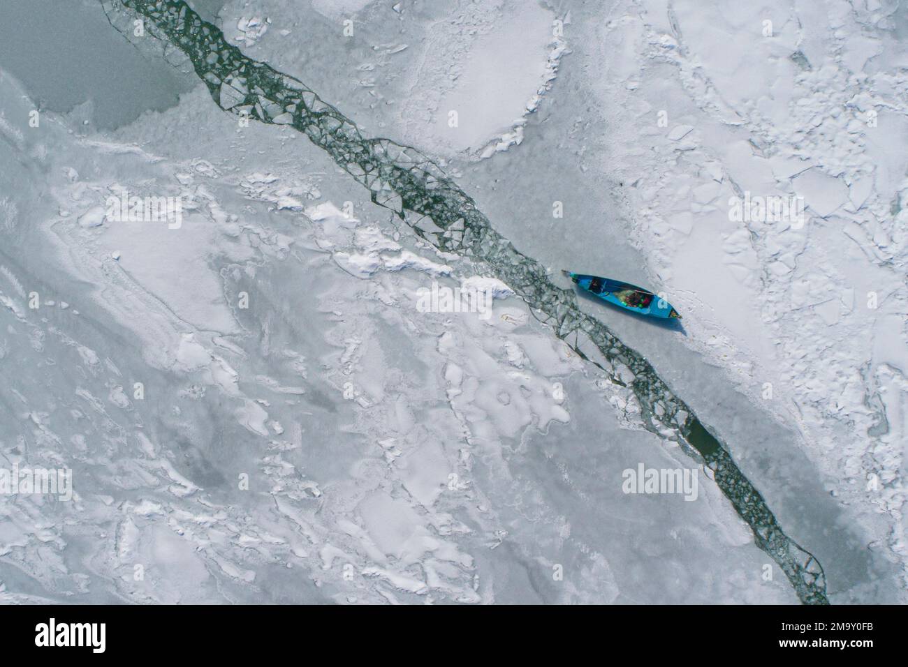 Fishing on frozen lake Stock Photo Alamy