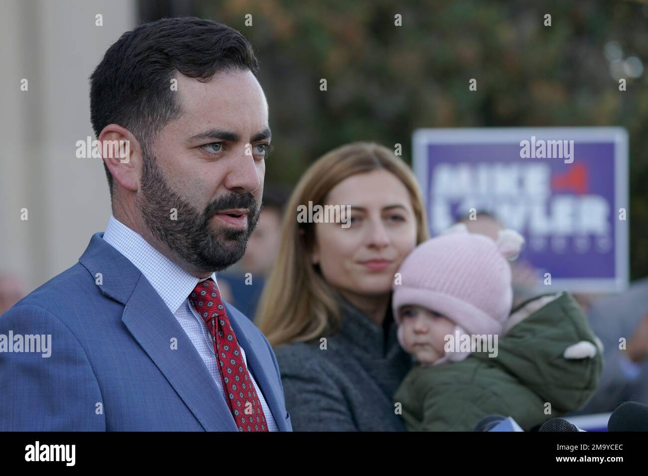 Mike Lawler, left, is joined by his wife Doina and daughter Julianna as