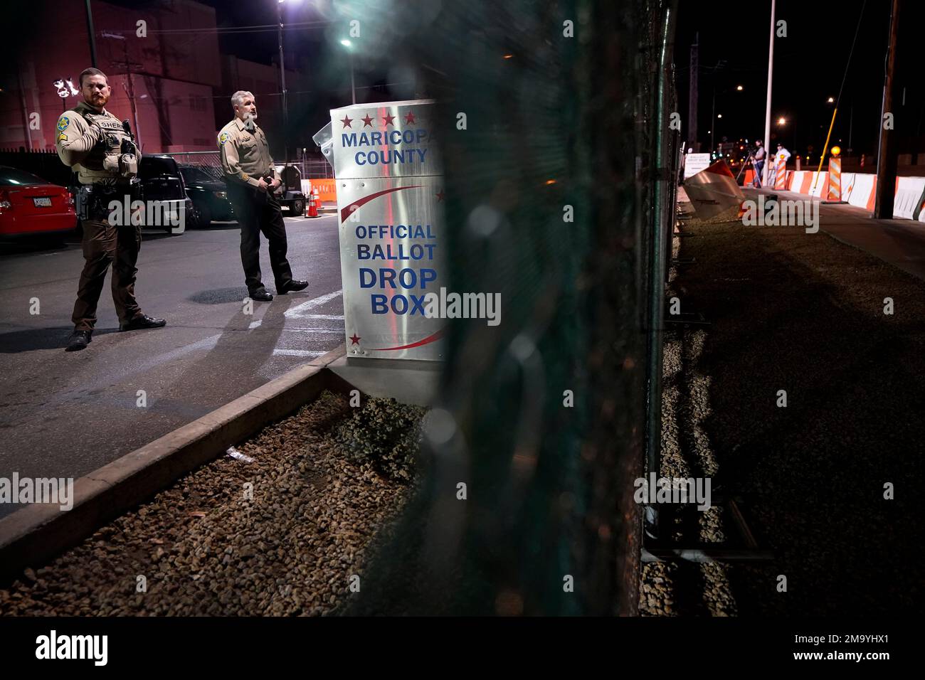 Maricopa County Sheriff's Deputies stand inside a secured area at the