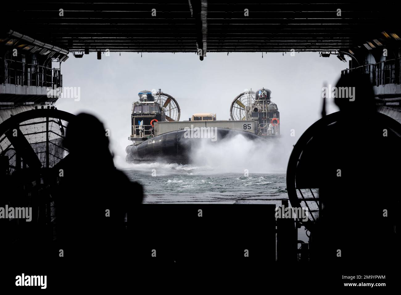 BALTIC SEA (May 21, 2022) – Landing Craft, Air Cushion 85, attached to Assault Craft Unit 4, approaches the well deck of the Wasp-class amphibious assault ship USS Kearsarge (LHD 3) May 21, 2022. Kearsarge, flagship of the Kearsarge Amphibious Ready Group and embarked 22nd Marine Expeditionary Unit, is participating in the Estonian-led exercise Siil 22 (Hedgehog 22 in English). Hedgehog 22 brings together members of the Estonian Defense Force and U.S. Sailors and Marines under Task Force 61/2 to enhance Allied interoperability and preserve security and stability in the Baltic region. Stock Photo