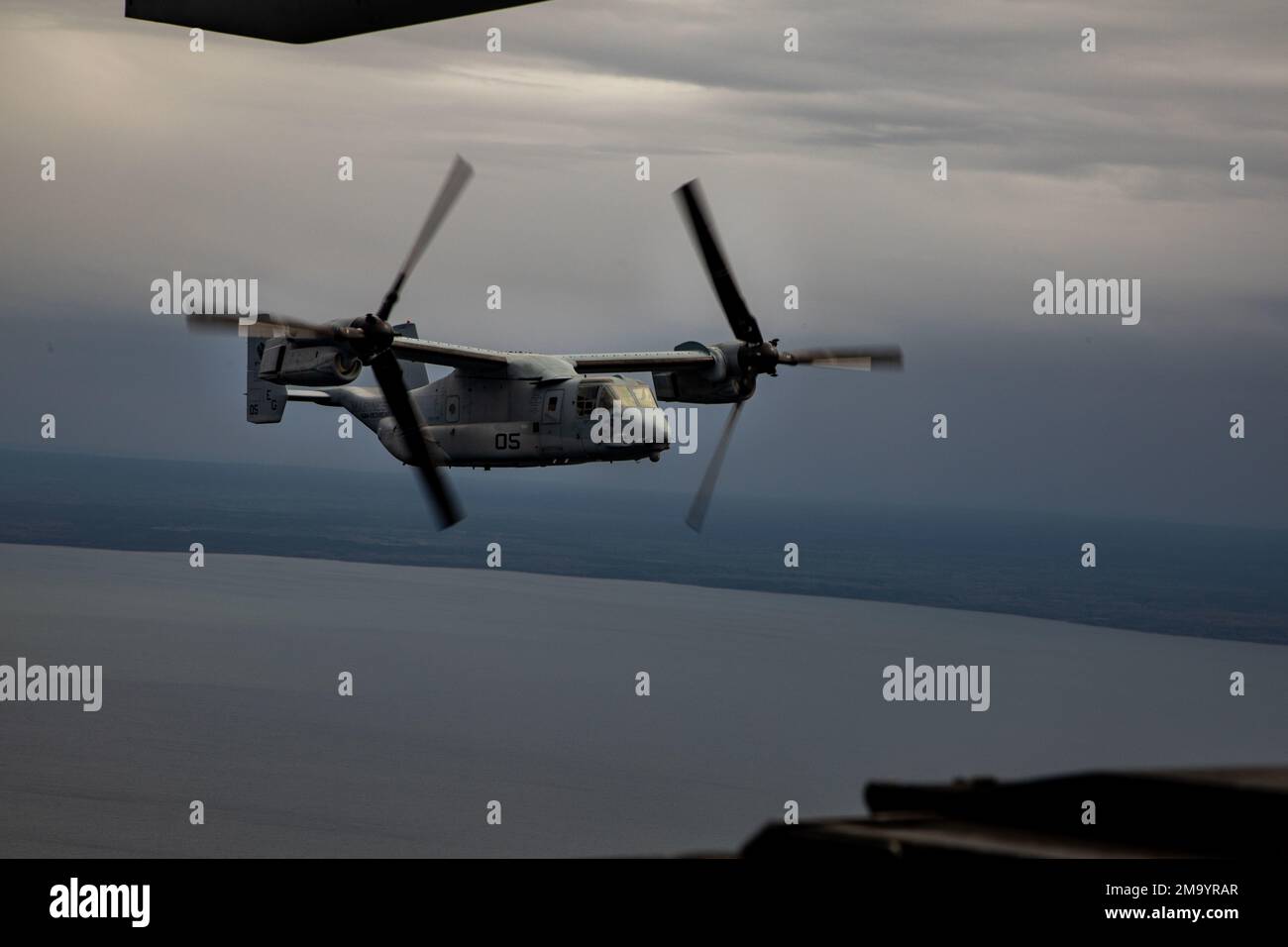 A U.S. Marine Corps MV-22 Osprey, assigned to the Aviation Combat Element, 22nd Marine Expeditionary Unit, travels from Parnu Airfield, Parnu, Estonia, back to Wasp-class amphibious assault ship USS Kearsarge (LHD 3), during ship-to-shore movements, May 21, 2022. The 22nd MEU is participating in the Estonian-led exercise Siil 22 (Hedgehog 22 in English). Hedgehog 22 brings together members of the Estonian Defense Force and Sailors and Marines under Commander Task Force 61/2 to enhance allied interoperability and preserve security and stability in the Baltic region. Stock Photo