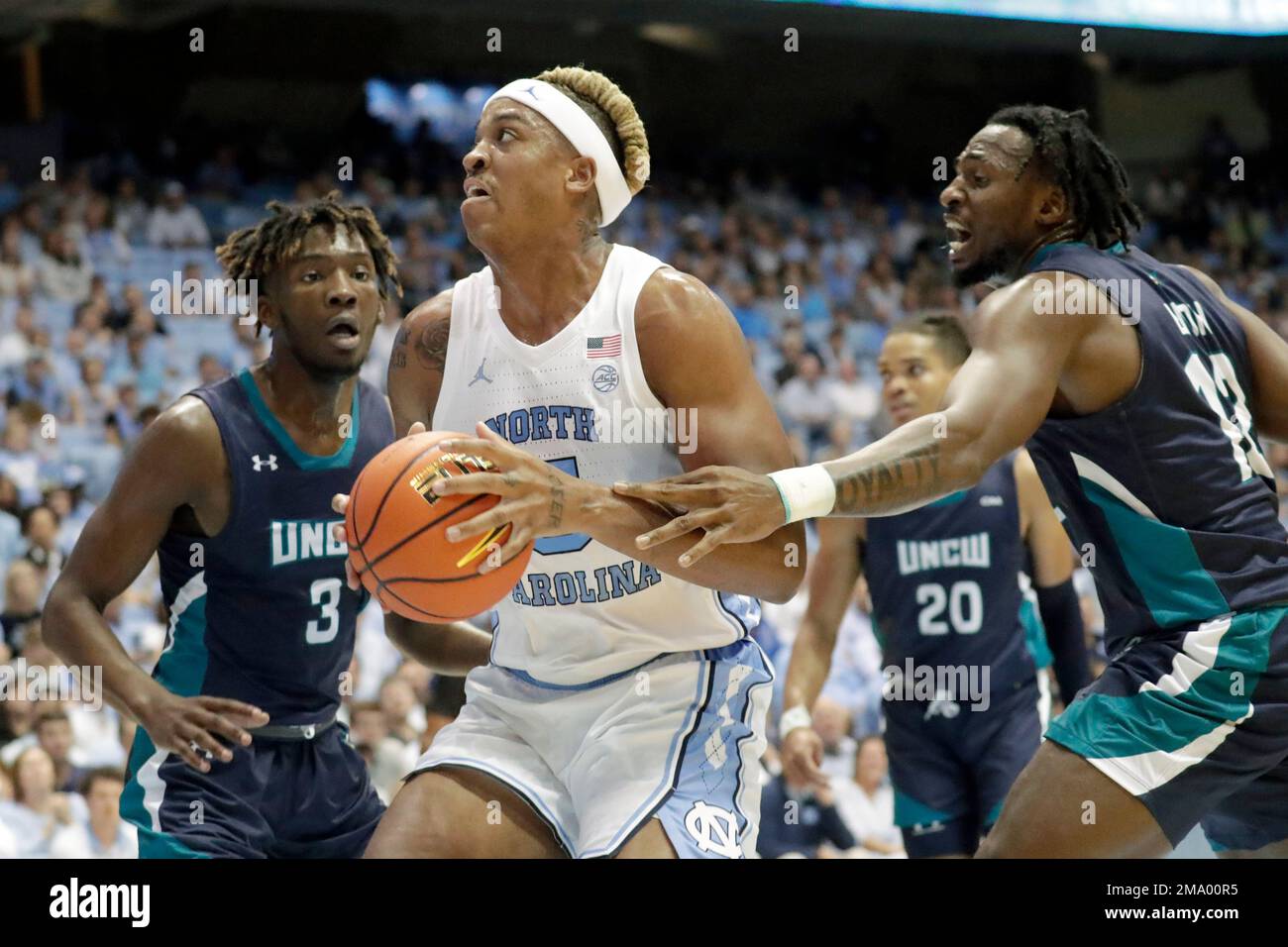 North Carolina forward Armando Bacot (5) drives against UNC Wilmington