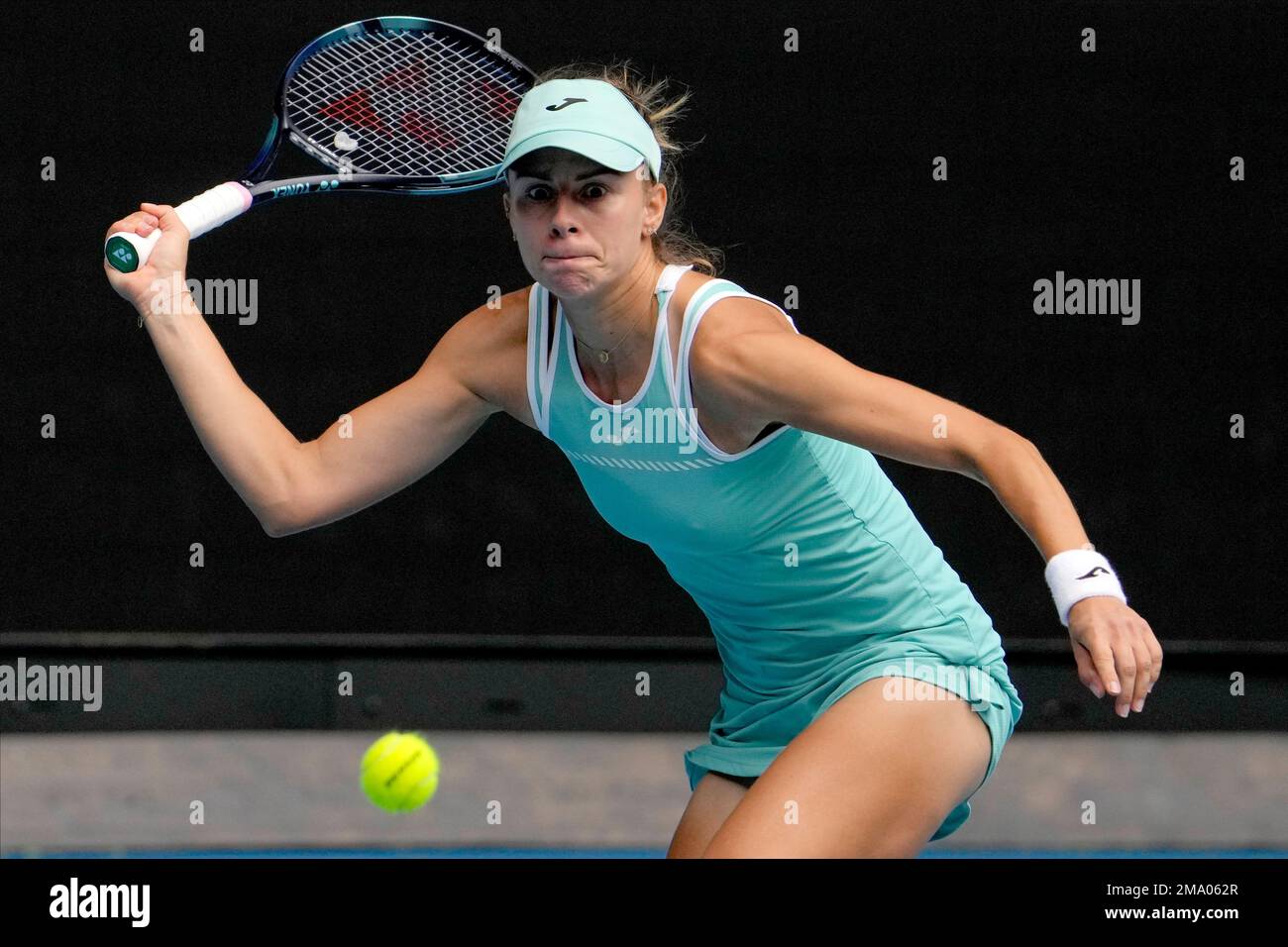 Magda Linette of Poland plays a forehand return to Anett Kontaveit of  Estonia during their second round match at the Australian Open tennis  championship in Melbourne, Australia, Thursday, Jan. 19, 2023. (AP