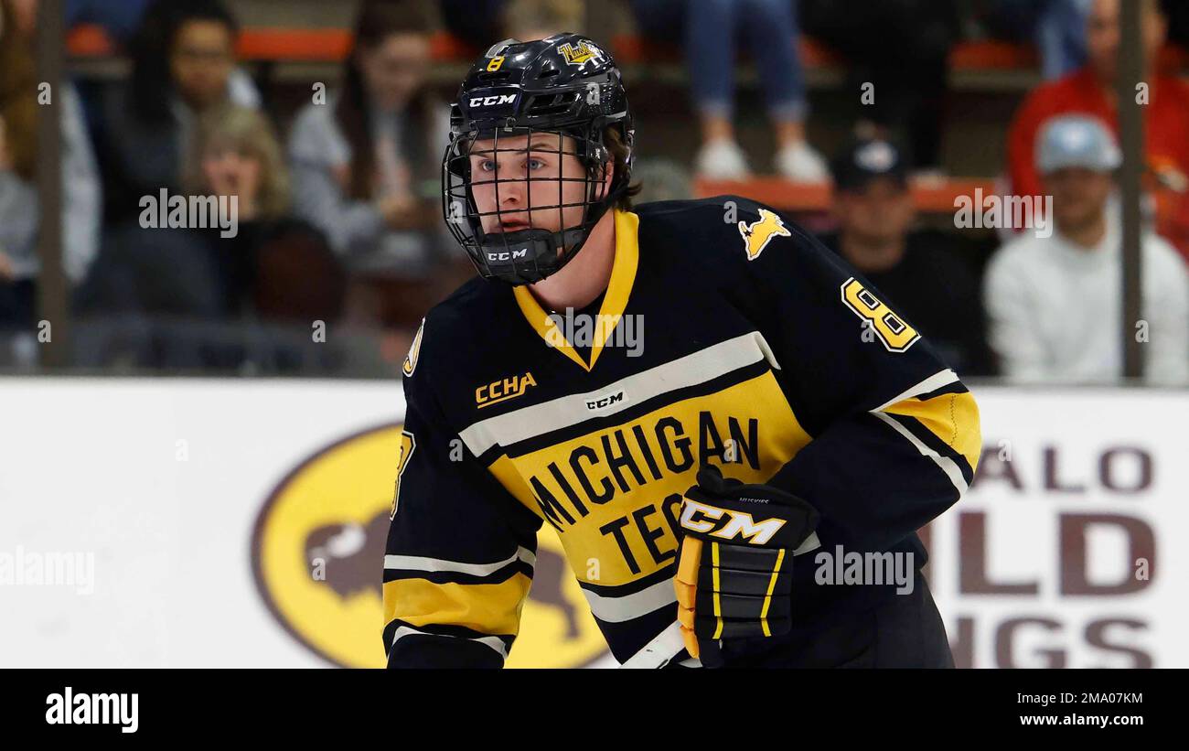 Michigan Tech defenseman Trevor Russell (8) skates against Bowling ...