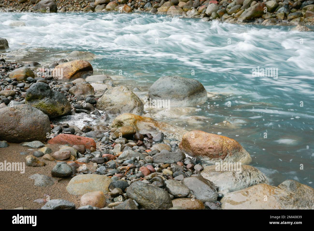 Turquoise Whangaehu River flowing over and through rocky terrain in ...
