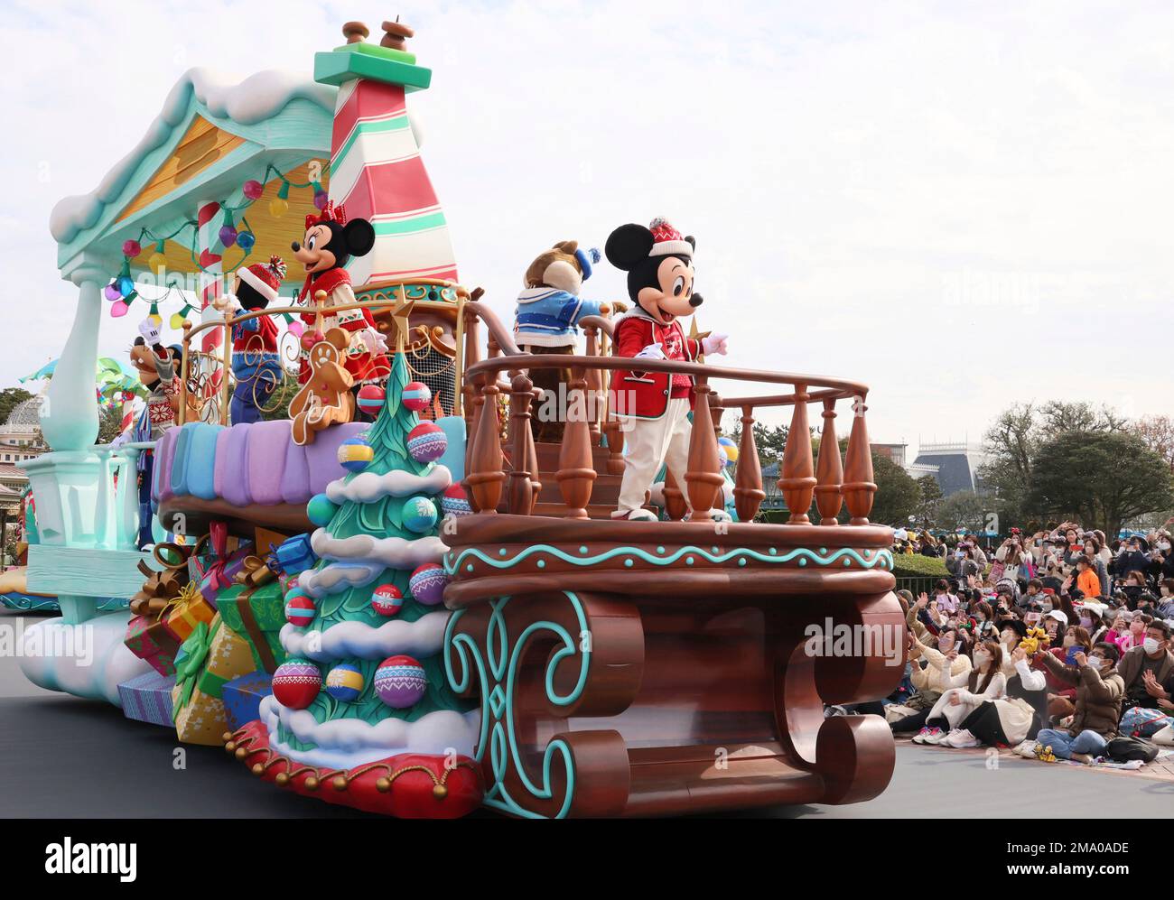 Disney characters Mickey and Minnie Mouse perform on a float for a