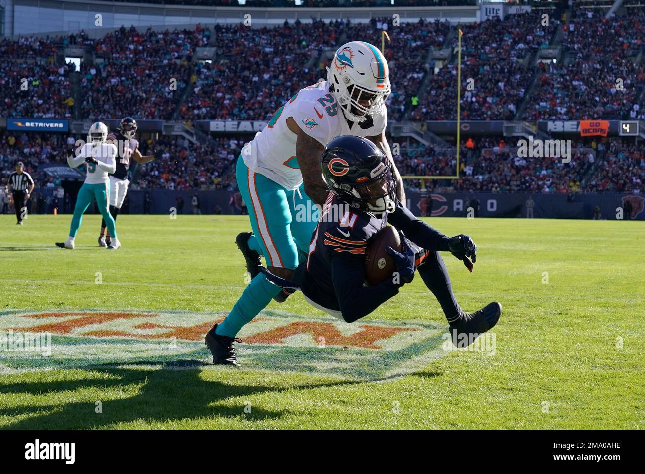 Chicago Bears wide receiver Darnell Mooney (11) scores against Miami