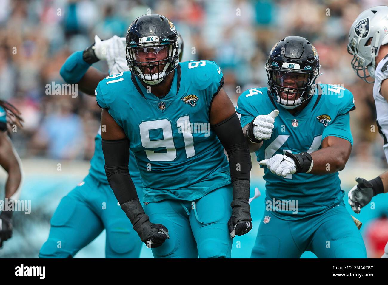 Jacksonville Jaguars defensive end Dawuane Smoot (91) and linebacker ...