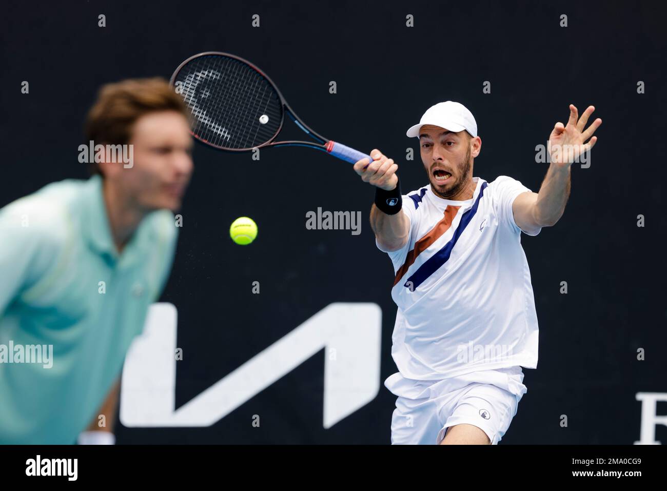 Melbourne, Australia. 19th Jan, 2023. Tennis: Grand Slam - Australian Open,  doubles, men, 1st round: Mahut/Pütz (France/Germany) - Barrientos/Behar  (Colombia/Uruguay). Tim Pütz (r) and Nicolas Mahut are in action. Credit:  Frank Molter/dpa/Alamy