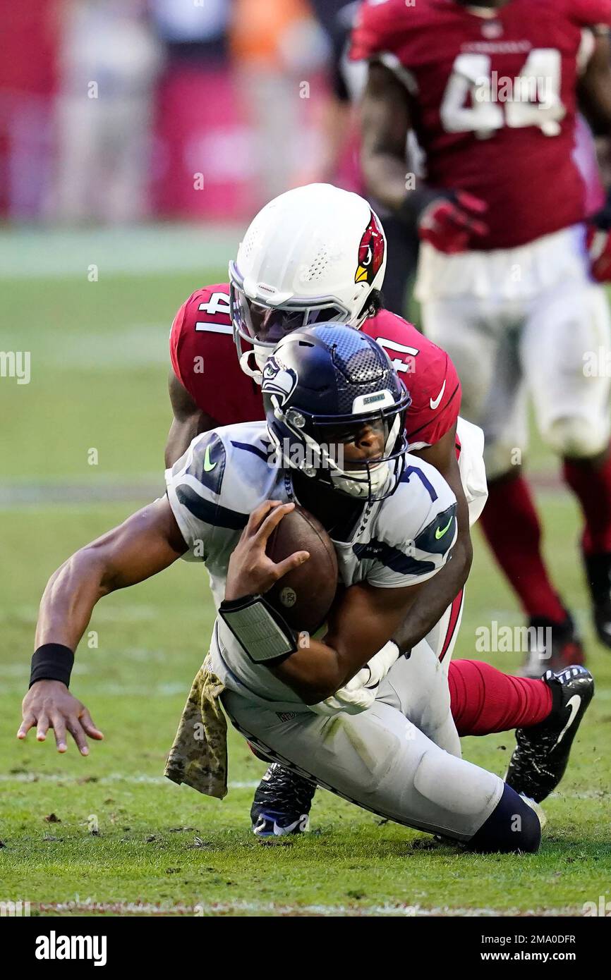 Arizona Cardinals linebacker Myjai Sanders (41) and Cardinals linebacker  Zaven Collins (25) celebrate a defensive stop against the Los Angeles  Chargers during the first half of an NFL football game in Glendale