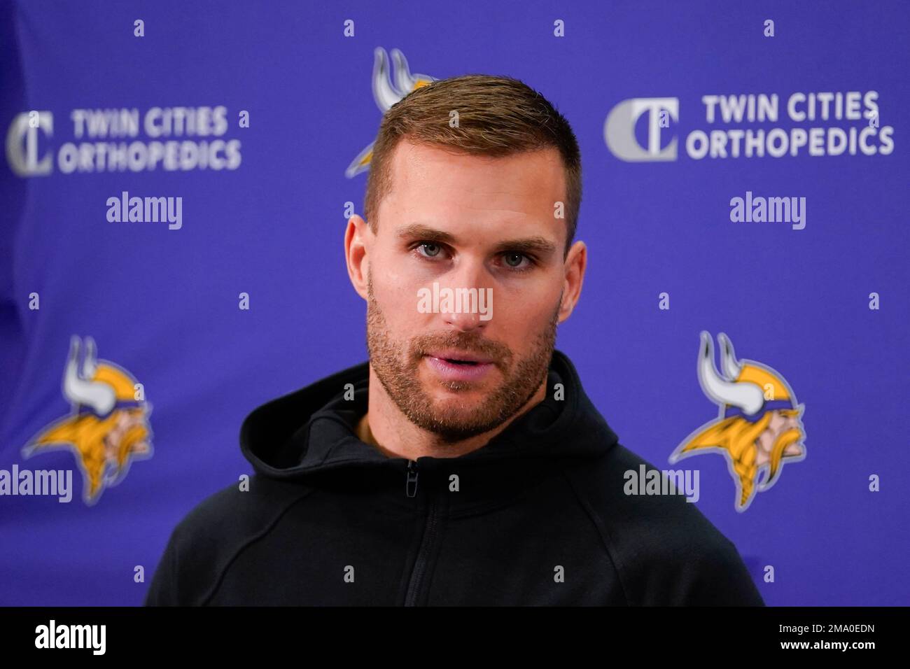 Minnesota Vikings quarterback Kirk Cousins (8) speaking to members of