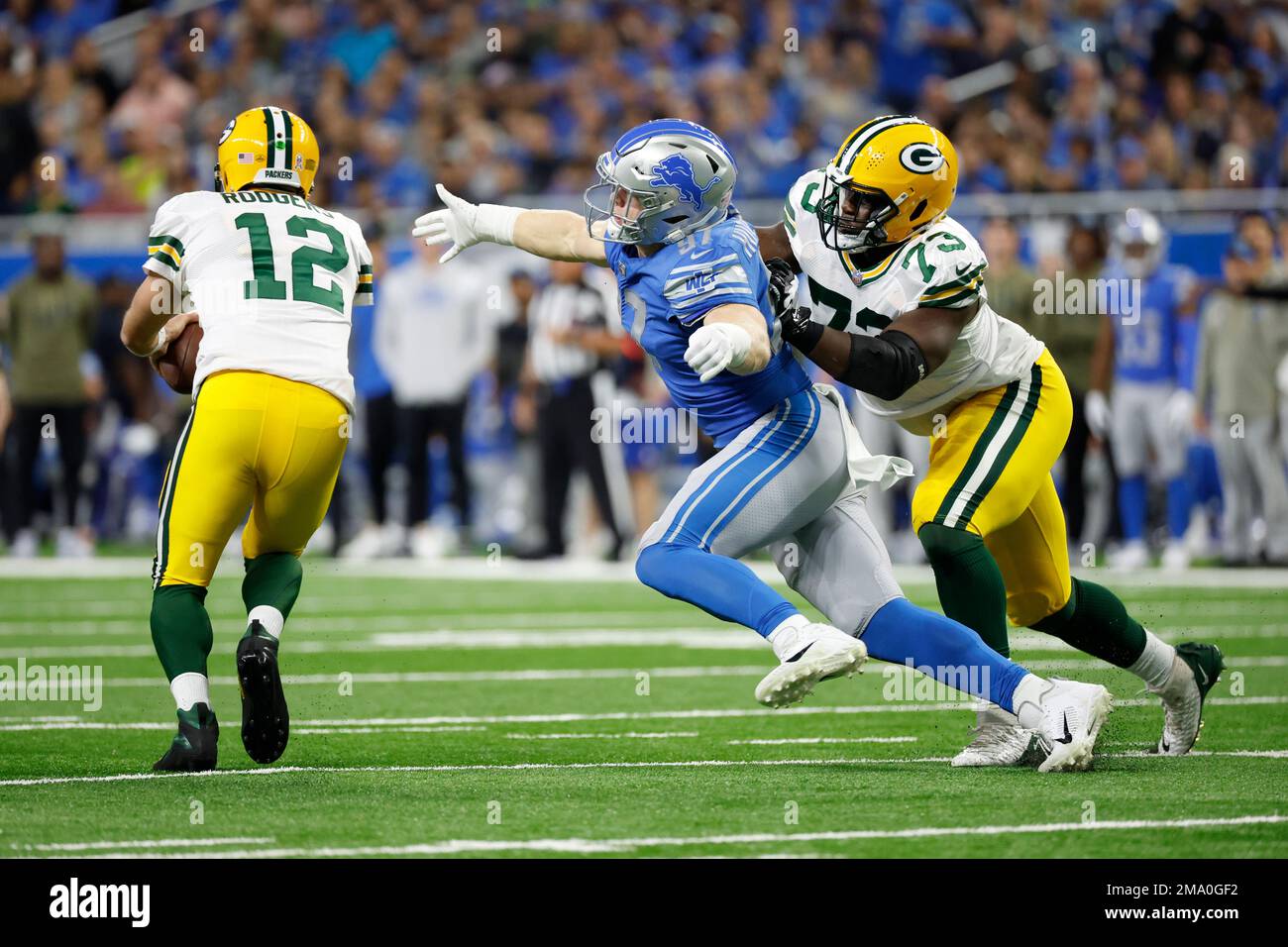 Detroit Lions defensive end Aidan Hutchinson (97) gets around the block ...